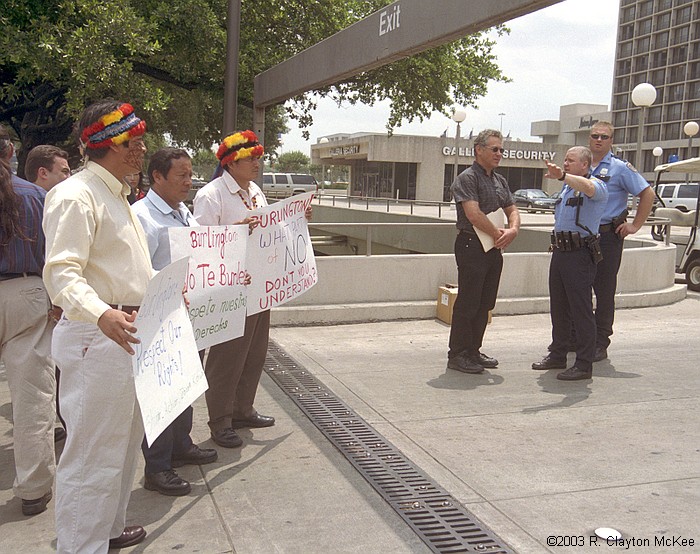 Leaders of the Amazon Nations of Ecuador and Peru visted Houston, Texas to formally reject any oil exploration or development in the Block 24 region of the Ecuadorian Amazon.  They held a news conference and issued an appeal for solidarity outside the Galleria headquarters of Burlington Resources, the concession holder. Milton Callera of FINAE, Bosco Najamdey of FIPSE, Pablo Tsere of FICSH, and Kenny Bruno of EarthRights International, are advised by HPD that Burlington officials have instructed that the visitorsl not be permitted on the property.