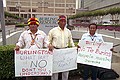 Presidents of the Amazon Federations of Ecuador and supporters held a press conference/demonstration outside the Galleria offices of Burlington Resources to reject officially any oil exploration or development activity in the Block 24 area of the Ecuadorian Amazon. Pablo Tsere, Prsident of FICSH (Shuar), Milton Callera, President of FINAE (Achuar), and Bosco Najamdey, President of FIPSE (Shuar), outside the Burlington Resources office complex.
