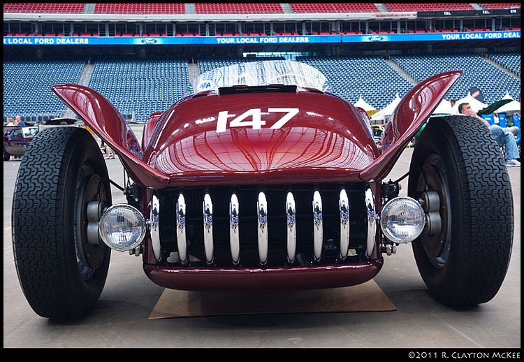 1958 Kurtis-Kraft 500S.  Odd looking beast with teeth.  They were successful racers in their day.