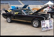 One of the original Hertz Shelby GT350H Rent-a-Racers.  There were a thousand of these, available only through the Hertz Sports Club ... if you were over 25 and had the green you could go rent yourself a genuine no-kidding bat out of hell racer for a day or a week.  I understand a lot of them went out over weekends and came back with fittings for roll bars and 5-point harnesses.