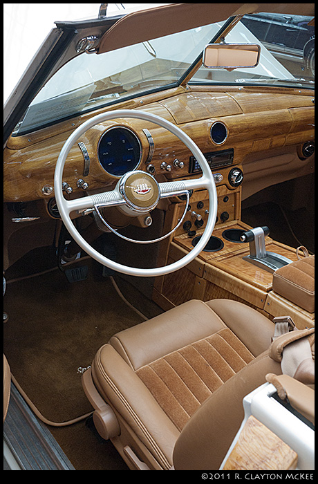 1949 Ford Convertible.  For some reason Ford stopped making "Woody" convertibles in 1948, so the owner did his own.  The result is... impressive.  VERY.