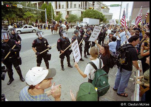 Austin Police in riot gear confront anti-corporate protesters during the Fortune 500 meeting protest.
