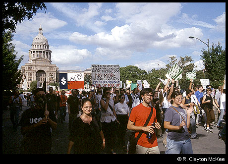 Anti-Corporate Protestors step off a march down Congress Avenue in front of the Texas Capitol Building