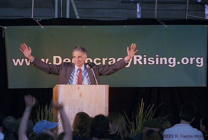 Consumer Advocate and Presidential Candidate Ralph Nader acknowledges the cheering crowd  crammed into Austin's Tony Burger Center for a Democracy Rising rally.  Nader was both the organizer and the keynote speaker for the event, which drew about 5500 political activists of various flavors from all over the state.
